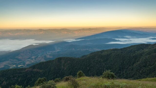Tropical forest nature landscape with mountain range and moving cloud mist time lapse at Kew Mae Pan nature trail, Doi Inthanon, Chiang Mai Thailand