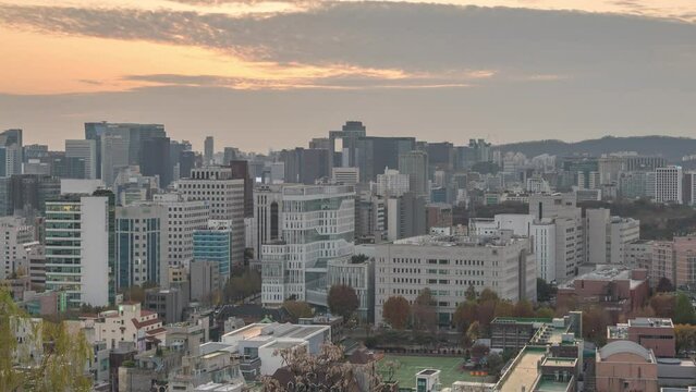 Seoul South Korea time lapse, day to night sunset city skyline at Seoul city center view from Naksan Park in autumn