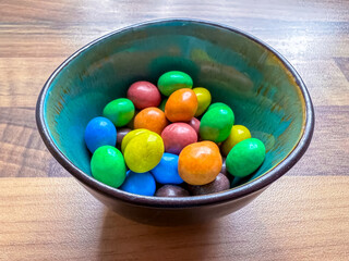 Bowl with colorful chocolate candy