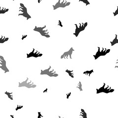 Seamless vector pattern with wolf symbols, creating a creative monochrome background with rotated elements. Illustration on transparent background