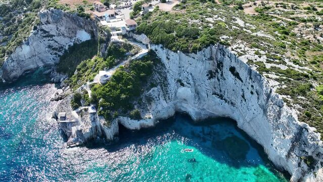 Blue Caves located between Aghios Nikolas and Cape Skinnari. Blue caves in zakynthos, Greece. Potamitis Dive Spot, Zakynthos, greece. Skinari View Point. Aerial drone view Turquoise ionian sea.