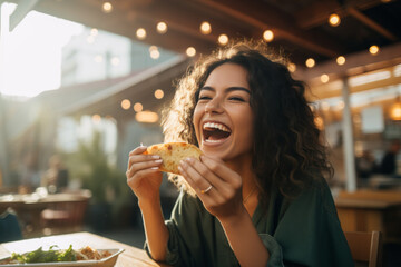 Young woman eating taco on a food court - obrazy, fototapety, plakaty