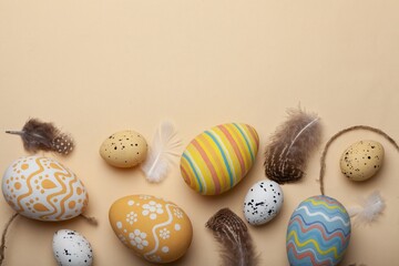 Easter concept, colored eggs with feather
