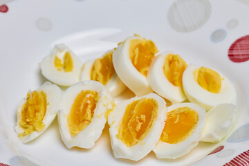 boiled eggs and cut in half in a plate