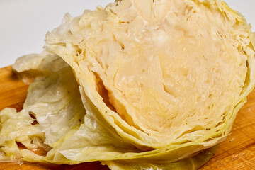 Sauerkraut on a wooden chopper ready to be cooked.