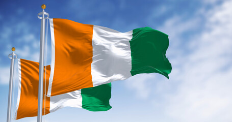 Ivory Coast national flag waving in the wind on a clear day
