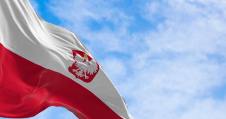 Close-up of Poland national flag waving in the wind on a clear day