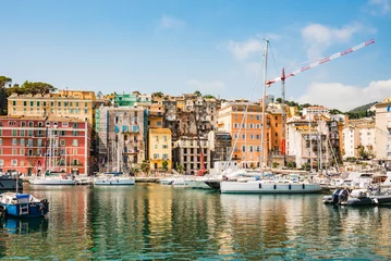 Tuinposter Corsica, Bastia panoramic view of Porto Vecchio old town and harbor, Corsica island, France. Old port with colorful facade and sailing boats, popular touristic travel destination. © travelbook