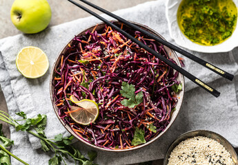 Asian red cabbage and carrot salad seasoned with coriander and sesame