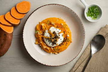 Sweet potato cream with poached egg and mushrooms.
