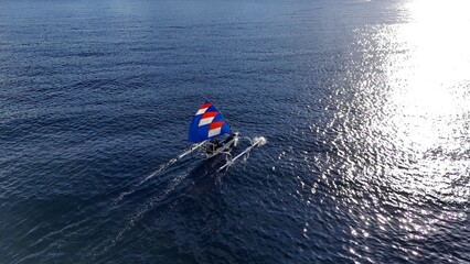Fishermen using traditional boats return home in the morning after fishing.

Lombok fishermen go fishing at night and return home in the morning