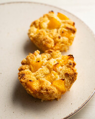 Peach crumble tartlet in a French pastry shop in Paris.