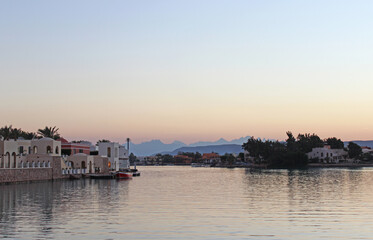 twilight at a quite marina with mountain silhouette at El Gouna, Egypt