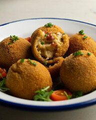 Spanish croquettes made with bechamel sauce and stuffed with octopus. Traditional tapa from northern Spain.