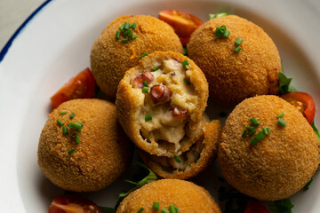 Spanish croquettes made with bechamel sauce and stuffed with octopus. Traditional tapa from northern Spain.