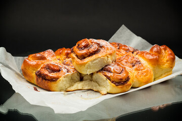 cooked baked sweet bun rolls with chocolate filling