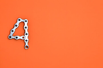 Metal Chain Number four Vibrant Orange Background with Bold Numeral 4 - Industrial Concept Stock Photo