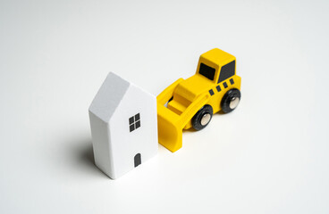 Demolition of buildings and structures. Territory clearing service. The bulldozer intends to...