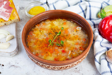 Minestrone soup. Vegetable soup with grilled bread, ham and spices