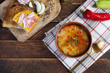 Minestrone soup. Vegetable soup with grilled bread, ham and spices