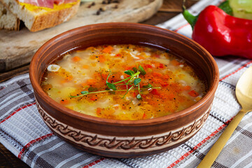 Minestrone soup. Vegetable soup with grilled bread, ham and spices