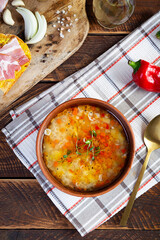 Minestrone soup. Vegetable soup with grilled bread, ham and spices