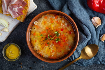 Minestrone soup. Vegetable soup with grilled bread, ham and spices