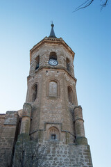 Fototapeta na wymiar Tower with clock of the church of Our Lady of the Assumption in Tembleque, province of Toledo. Spain