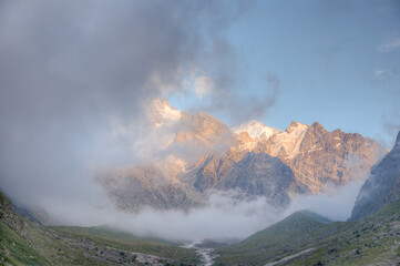 Mountain peaks surrounded by clouds.