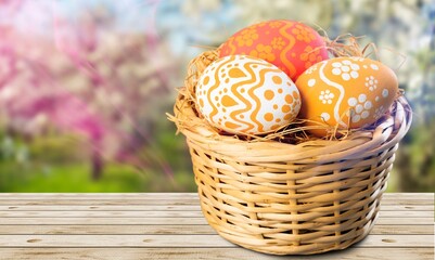 Collection of the beautiful colored easter eggs in the basket