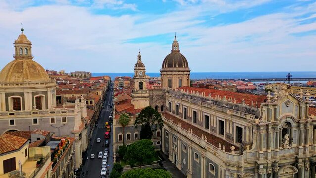 Catania, Sicily island, Italy. Drone aerial view 4k video, Europe ancient historical city center Duomo square, Cathedral of st. Agatha and elephant statue, travel Mediterranean seacoast port