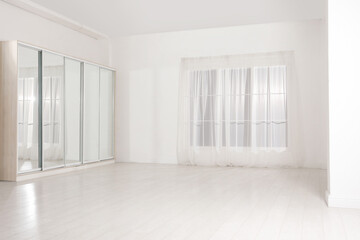 Obraz premium Empty room with white walls and large window