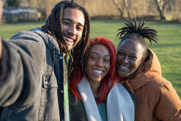 Fototapeta premium Portrait of group of friends embracing