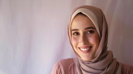 A smiling muslim female wearing a hijab, islamic traditional clothing picture