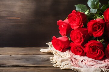 Bouquet of red roses on the wooden table.