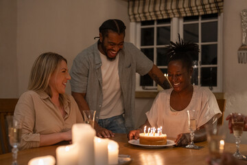 Friends celebrating birthday at home 