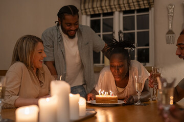 Friends celebrating birthday at home 