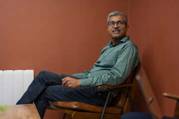 Fototapeta premium Mature businessman sitting in conference room