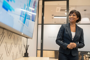 Businesswoman giving presentation in office