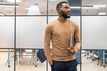 Young businessman standing in office