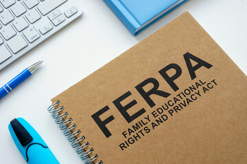 Book FERPA family educational rights and privacy act on the table.