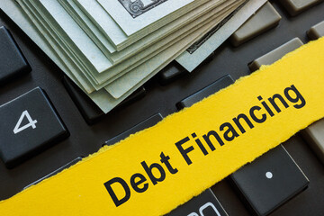 Money, calculator and inscription Debt financing.
