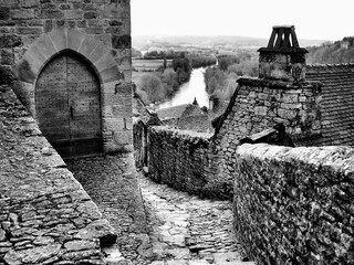 Black and white photo of a landscape view looking over the River Dordogne, from Beynac et Cazenac a...