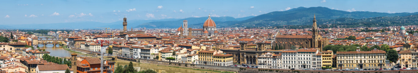 Fototapeta premium Florence city with Santa Maria del Fiore with huge Brunelleschi's dome, Giotto's Bell Tower, Basilica di Santa Croce, Ponte Vecchio, Palazzo Vecchio. Panoramic view from Piazzale Michelangelo, Toscana