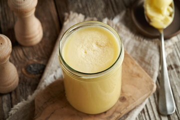 A jar of ghee or clarified butter on a table