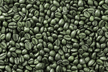 Background from coffee raw grains. Green coffee for frying. Coffee preparation