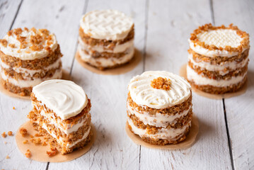 Small carrot cakes on white background