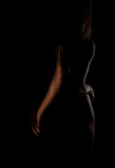 Light art on a woman's slender naked body.