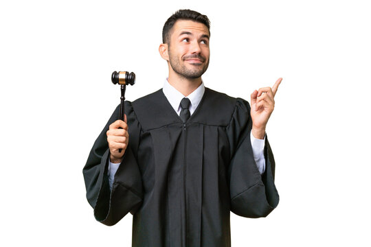 Judge caucasian man over isolated background pointing up a great idea