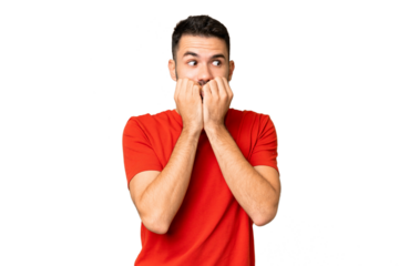 Young handsome caucasian man over isolated chroma key background nervous and scared putting hands to mouth